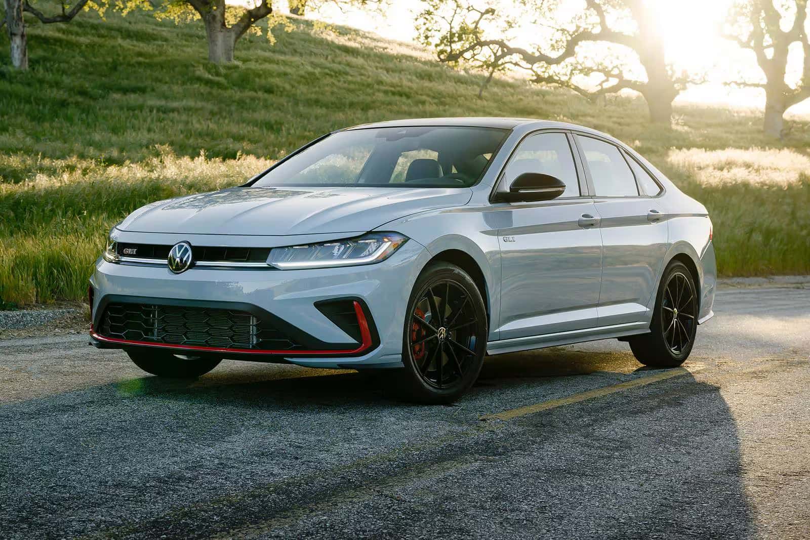 2026 Jetta GLI parked by a grassy hill