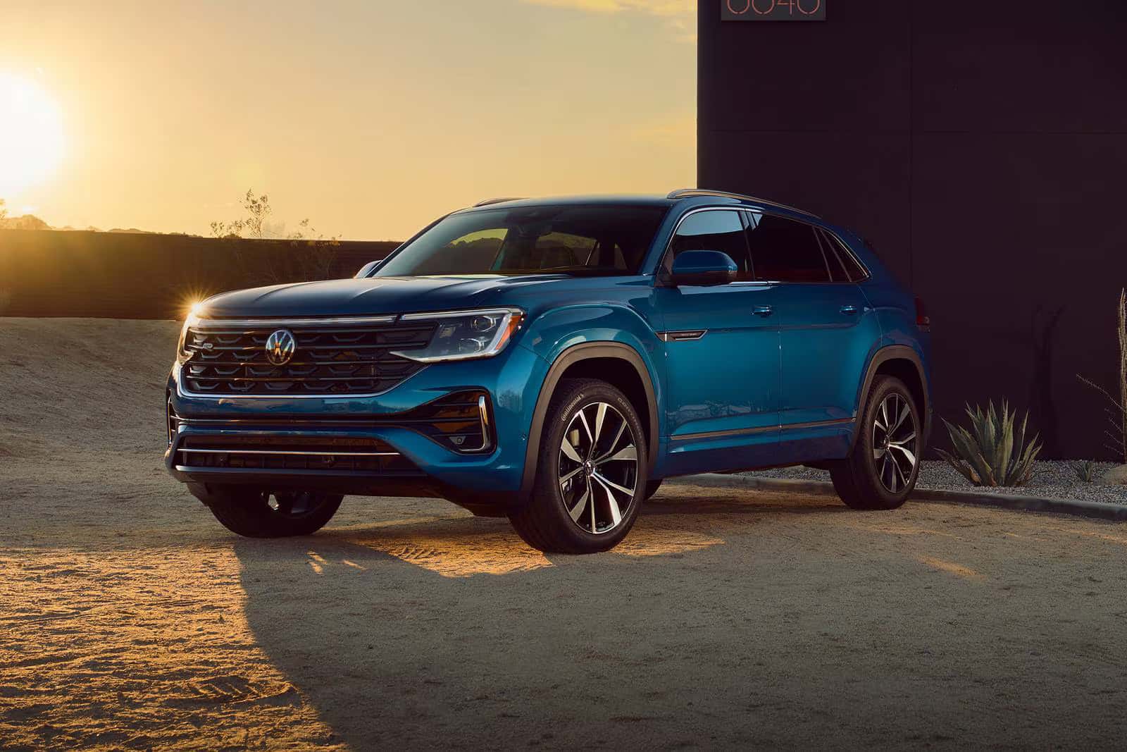 a view of the new 2026 Volkswagen Atlas parked with a sunset view in the backgrounf