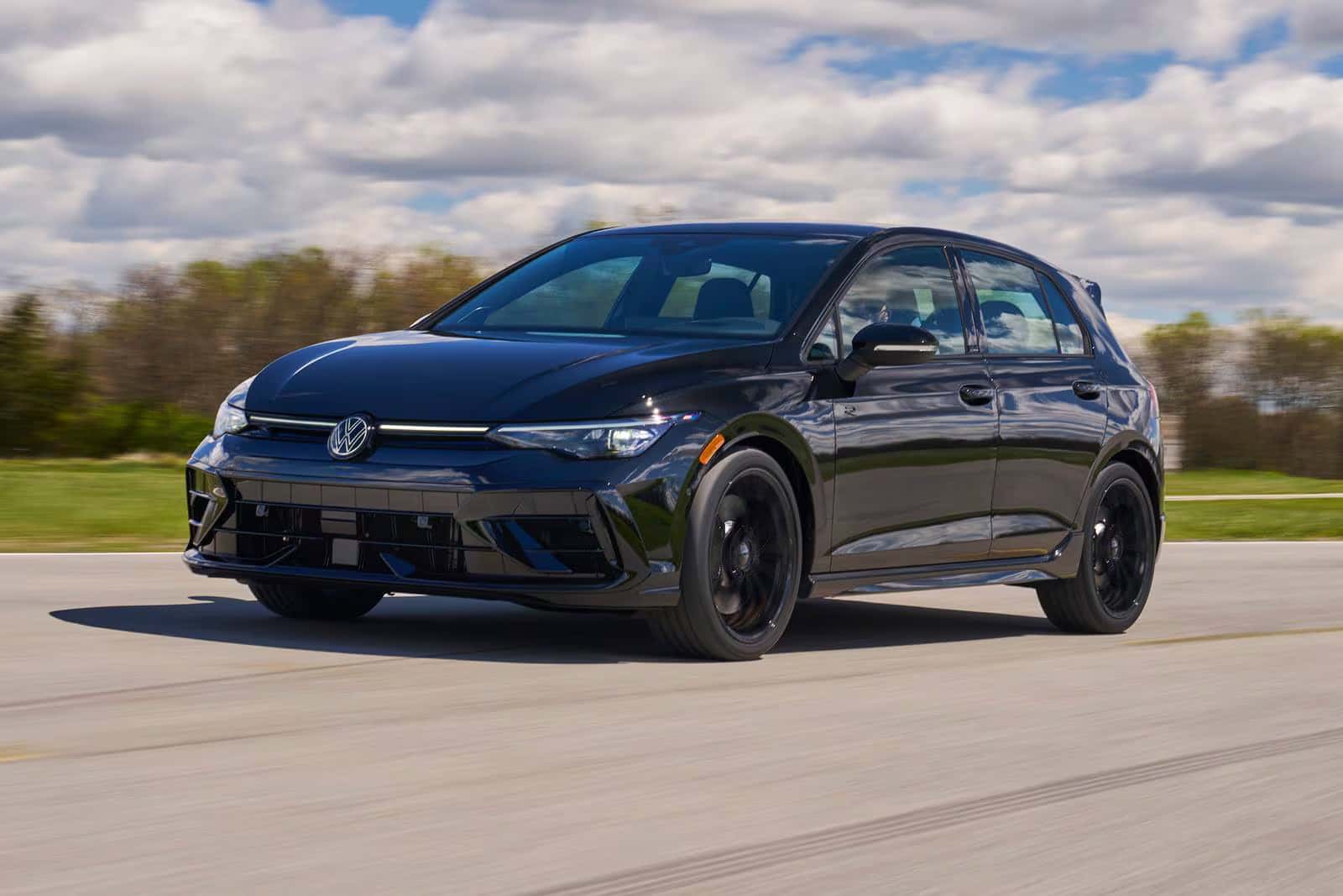 a 2026 volkswagen golf r driving on a street