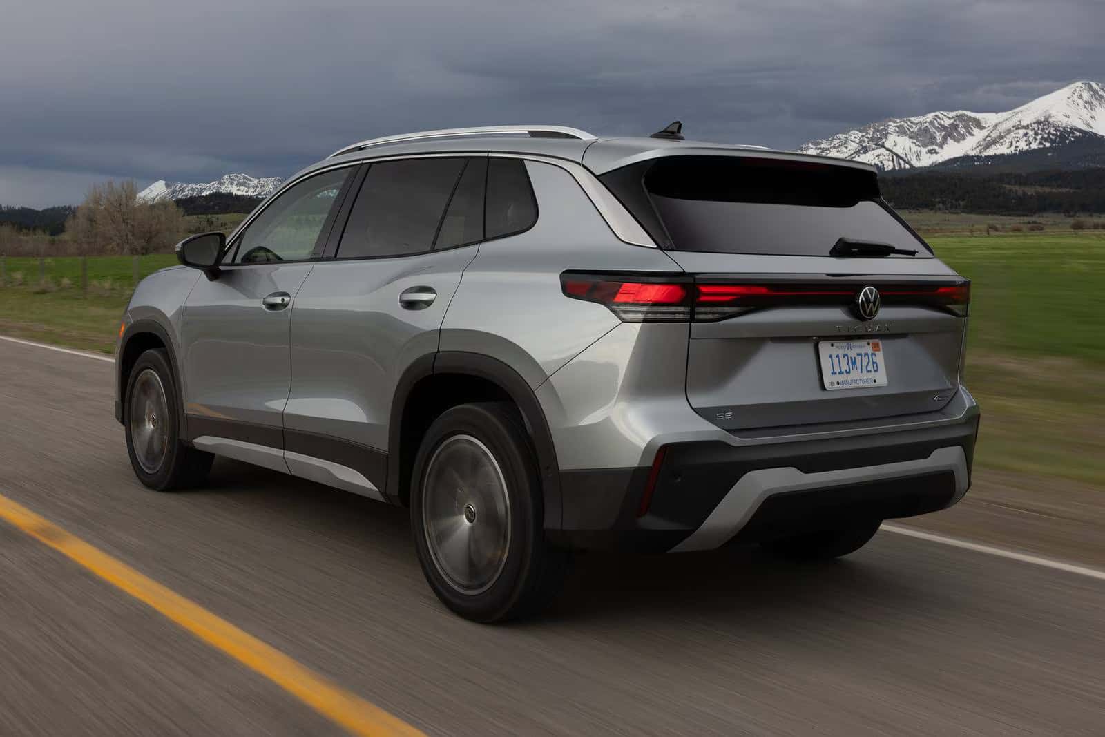 a new look at the 2026 volkswagen tiguan driving on a road