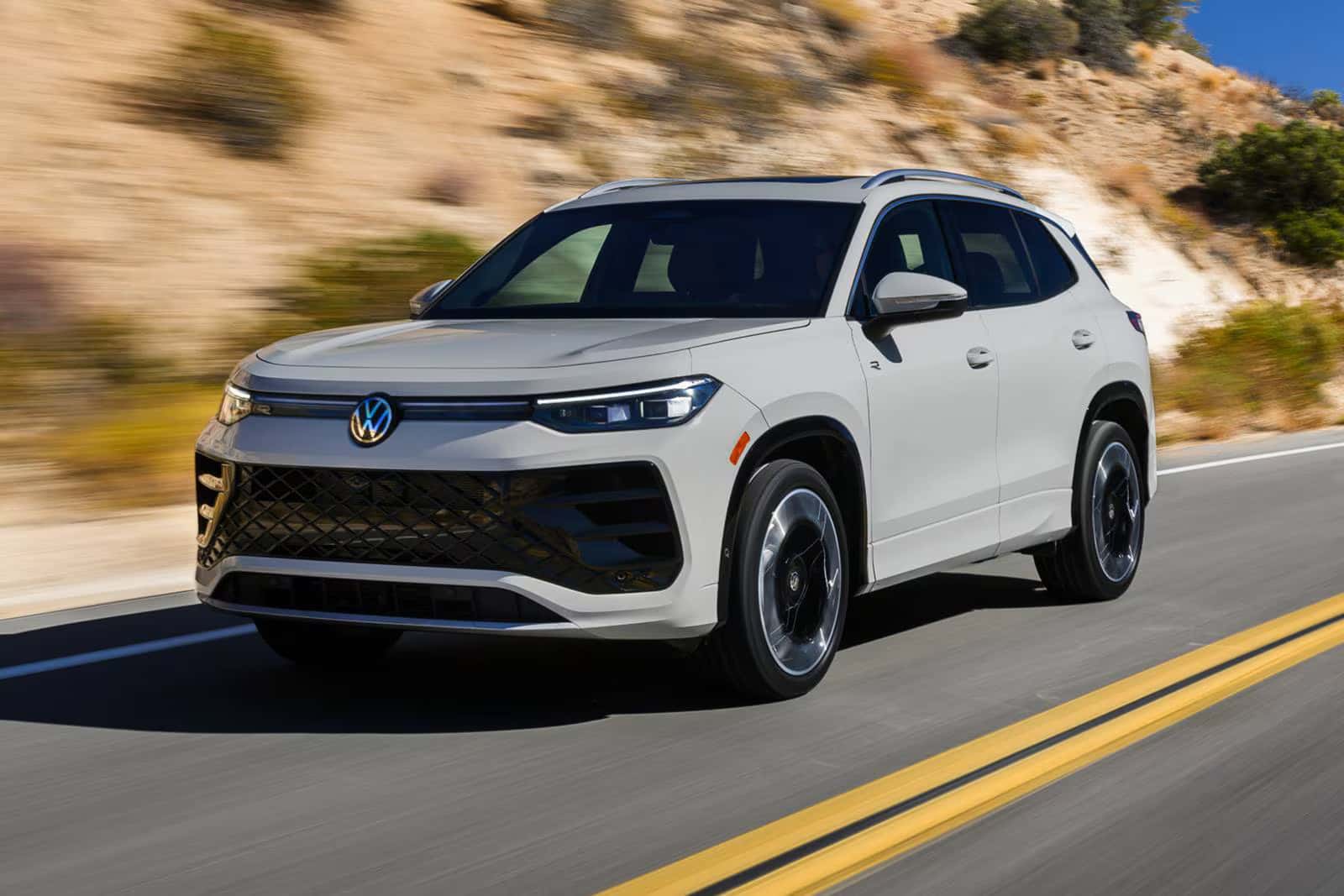 a new look at the 2026 volkswagen tiguan driving on a road