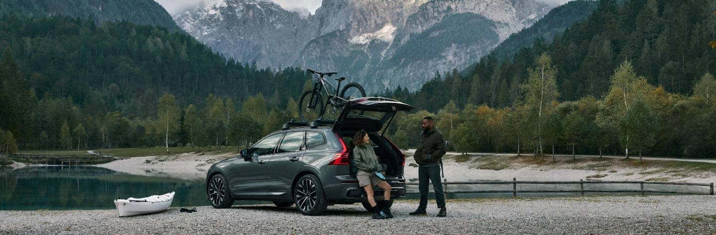 Volvo parked at a lake by the mountains