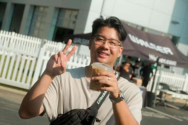 Guy at Subarus and Cold Brews Holding Cup of Cold Brew Coffee