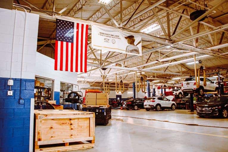 Chevrolet technician performing brake service at Webb Chevy Oak Lawn in Oak Lawn, IL