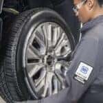 Technician-working-on-tire-of-a-vehicle