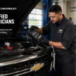 Certified technician performing a Chevy oil change at Webb Chevy Oak Lawn in Oak Lawn, IL