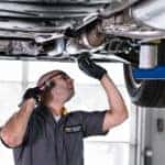 Service Technician working on Chevy Engine