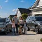 2026 Chevy Equinox and Traverse parked side by side with a family in Plainfield, Illinois at Webb Chevy Plainfield