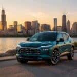 2027 Chevrolet Trax ACTIV with the Chicago skyline at sunset at Webb Chevy Plainfield, Plainfield, IL