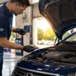Certified Hyundai service technician performing summer maintenance at Webb Hyundai Merrillville in Merrillville, IN