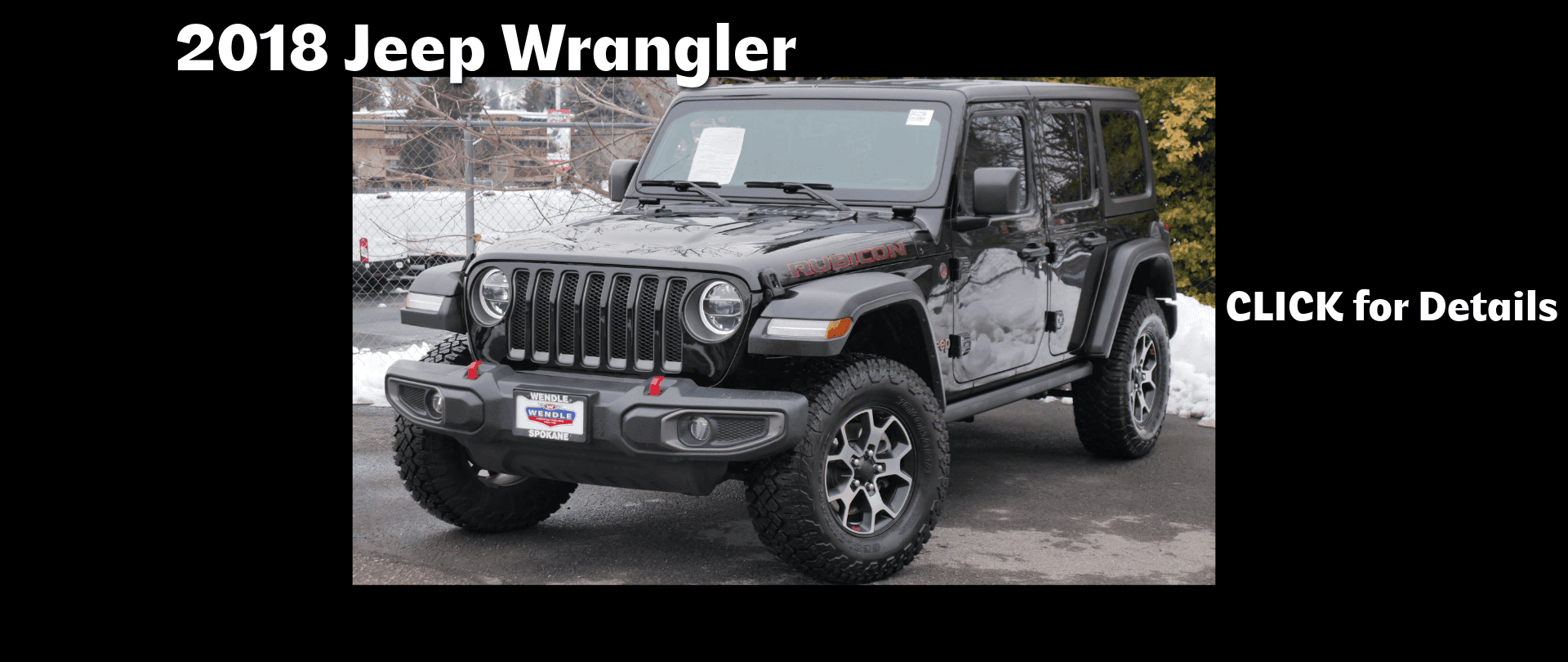 A black jeep parked in a lot