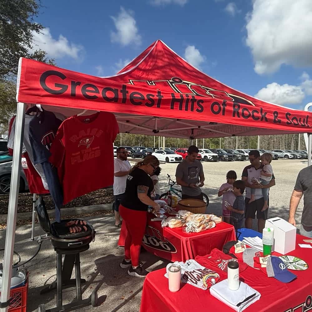 Outside Hits 106 Radio Tent at Event