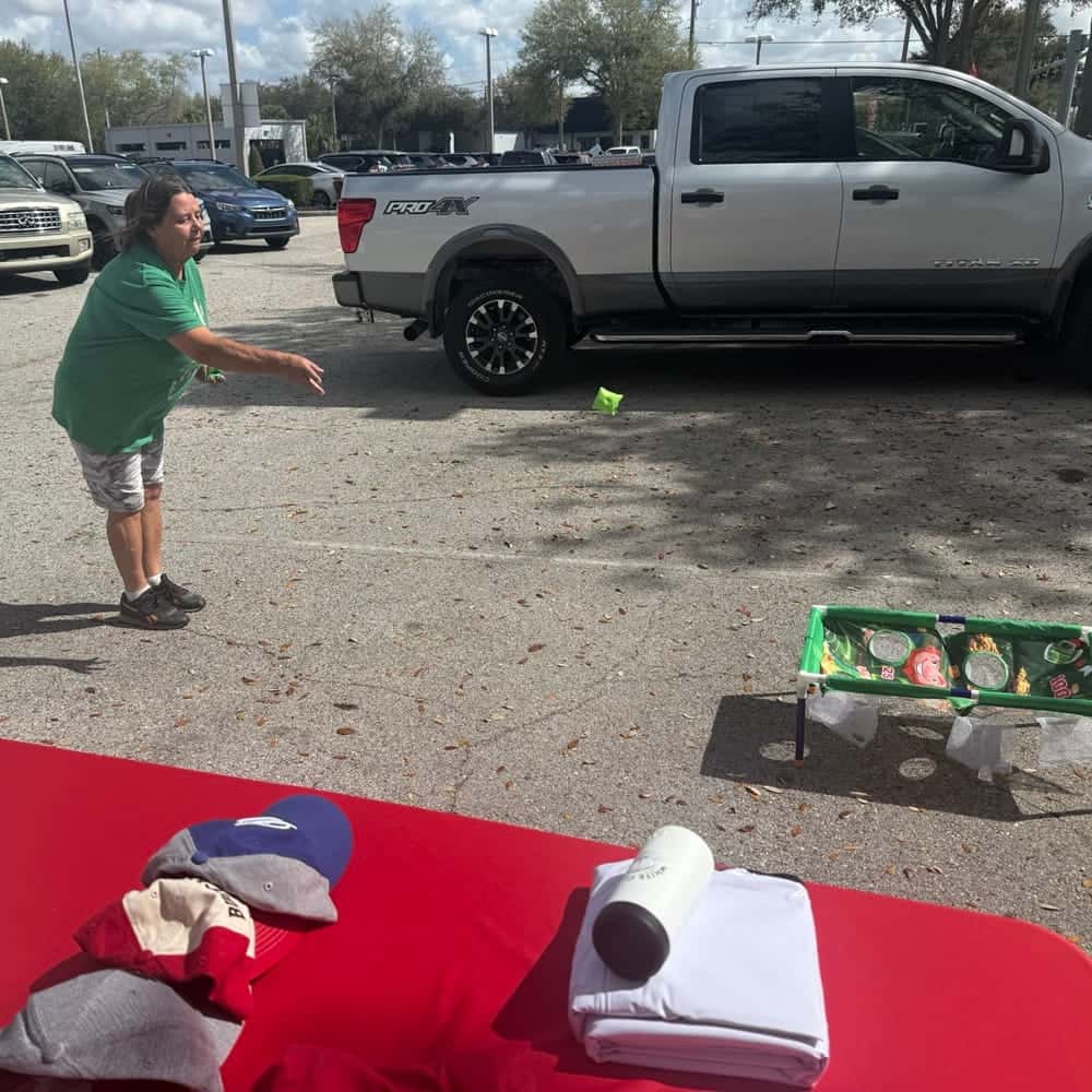 Woman Playing Corn Hole at Event