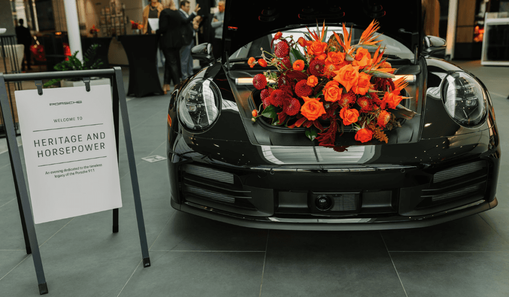 Porsche 911 with front trunk floral display at Porsche Des Moines grand opening event