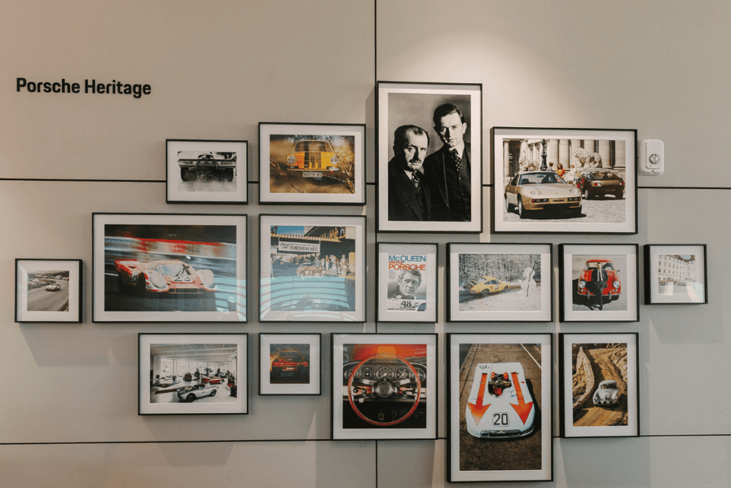 Wall of Porsche heritage photos on display at Porsche Des Moines grand opening event
