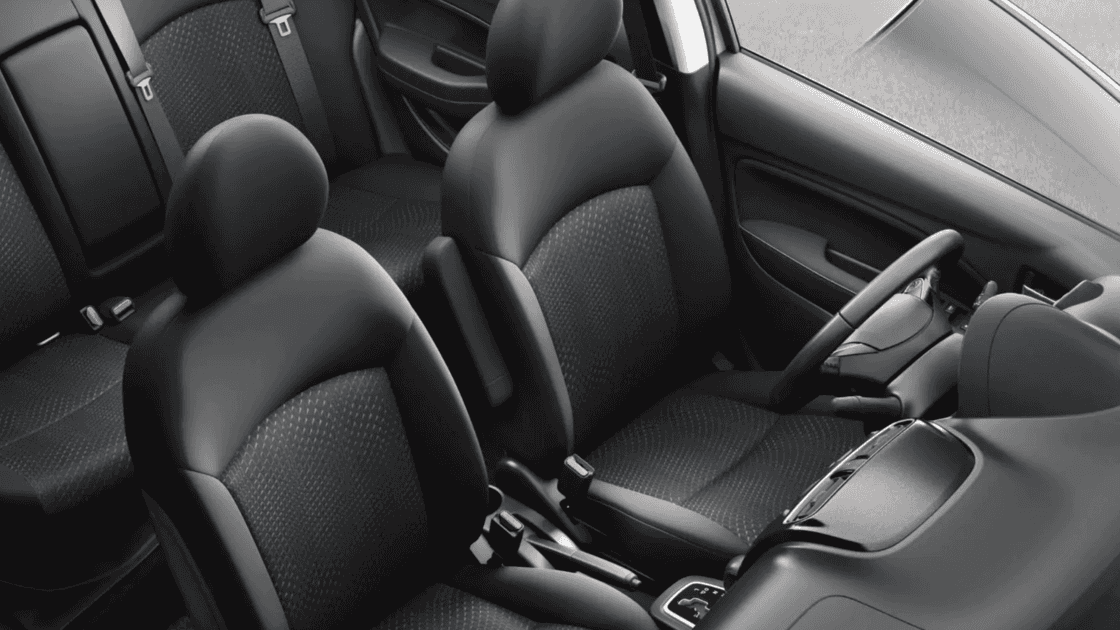 2024 Mitsubishi Mirage G4 interior showing front seats, rear seating, and center console in compact sedan cabin