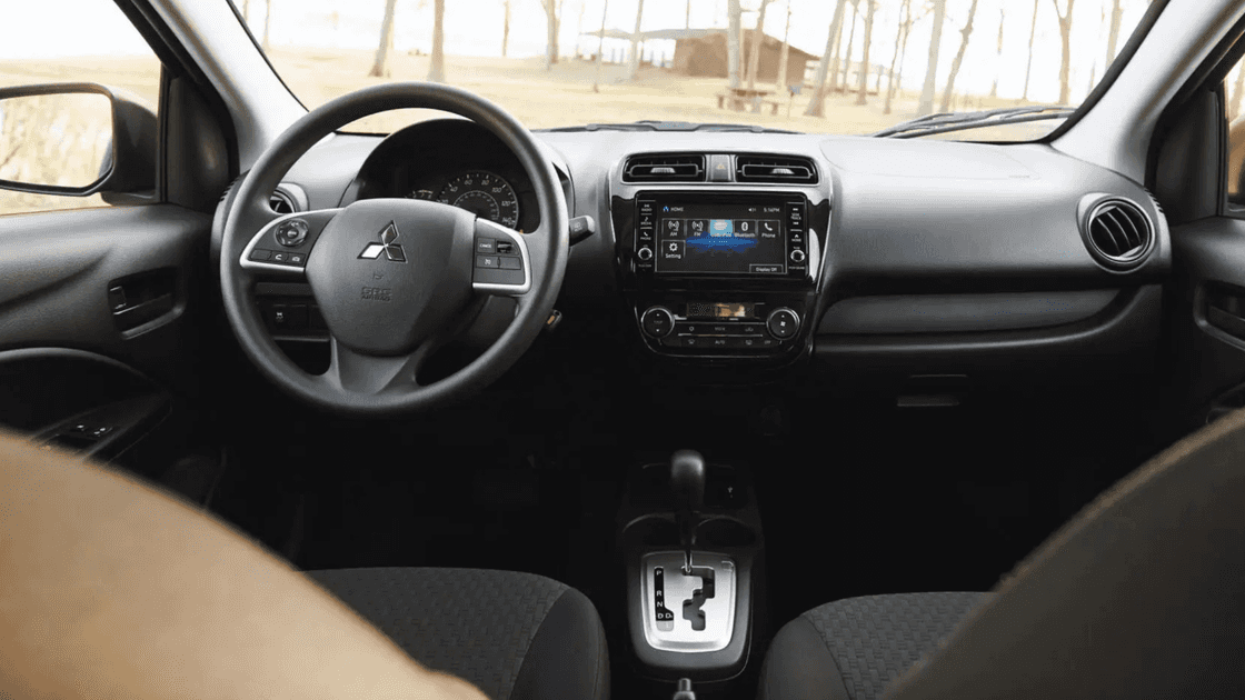 2024 Mitsubishi Mirage G4 interior cockpit with touchscreen display, steering wheel controls, automatic shifter, and front seating