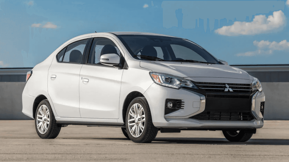 2024 Mitsubishi Mirage G4 front three quarter exterior in silver showing grille, headlights, alloy wheels, and compact sedan stance
