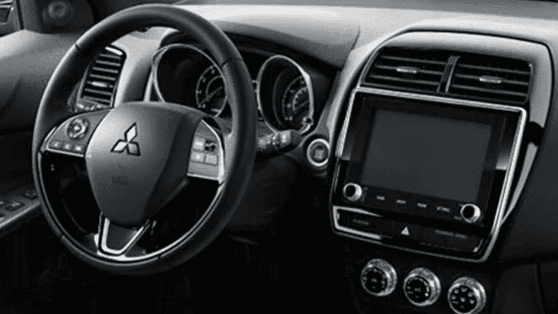 Interior view of the 2025 Mitsubishi Outlander PHEV, featuring modern seats and an advanced infotainment system.