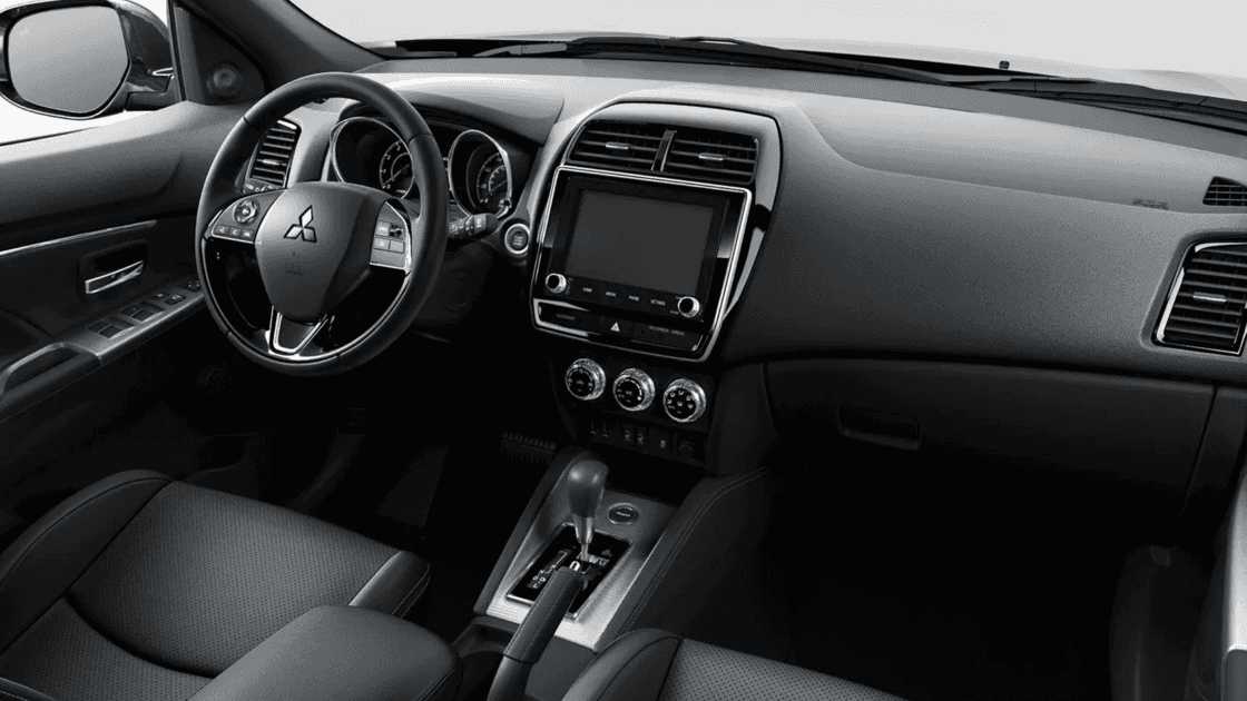 2024 Mitsubishi Outlander Sport interior cockpit with touchscreen infotainment, steering wheel controls, and automatic center console