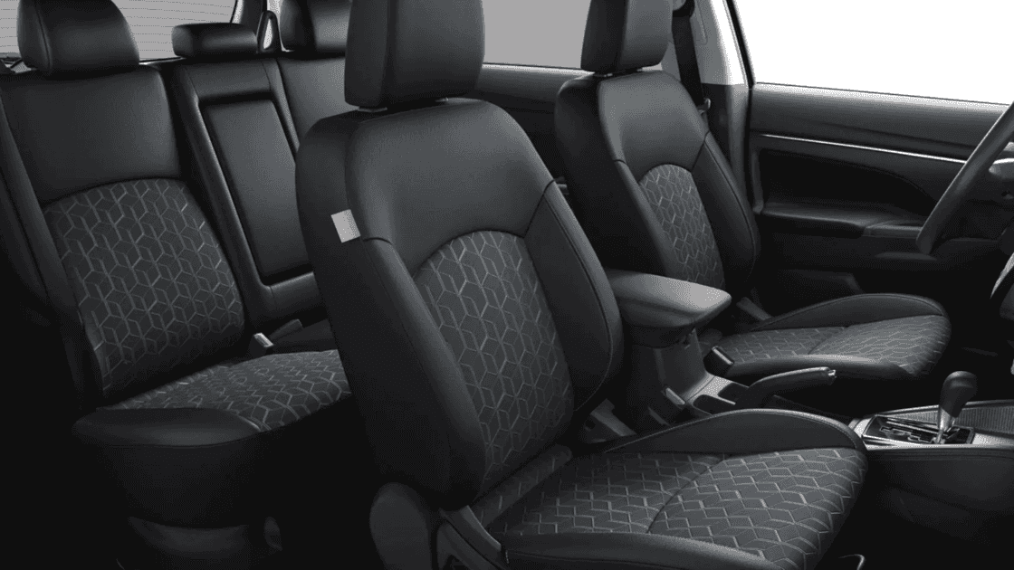 2024 Mitsubishi Outlander Sport interior seating showing patterned cloth front seats, rear bench, and center armrest