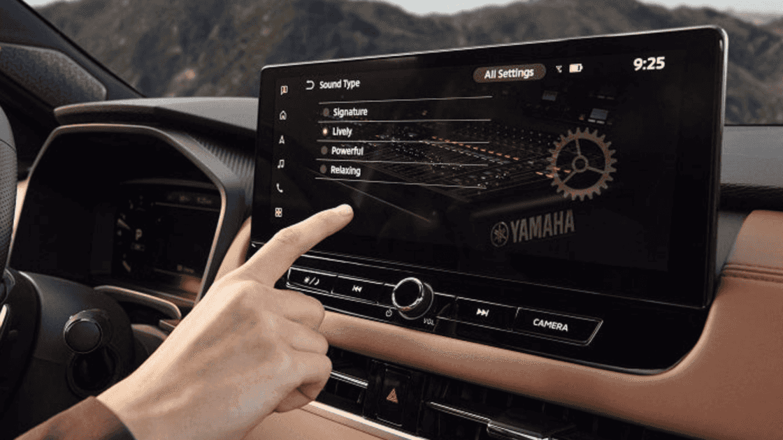 2024 Mitsubishi Outlander dashboard interior with touchscreen infotainment, steering wheel controls, and automatic shifter