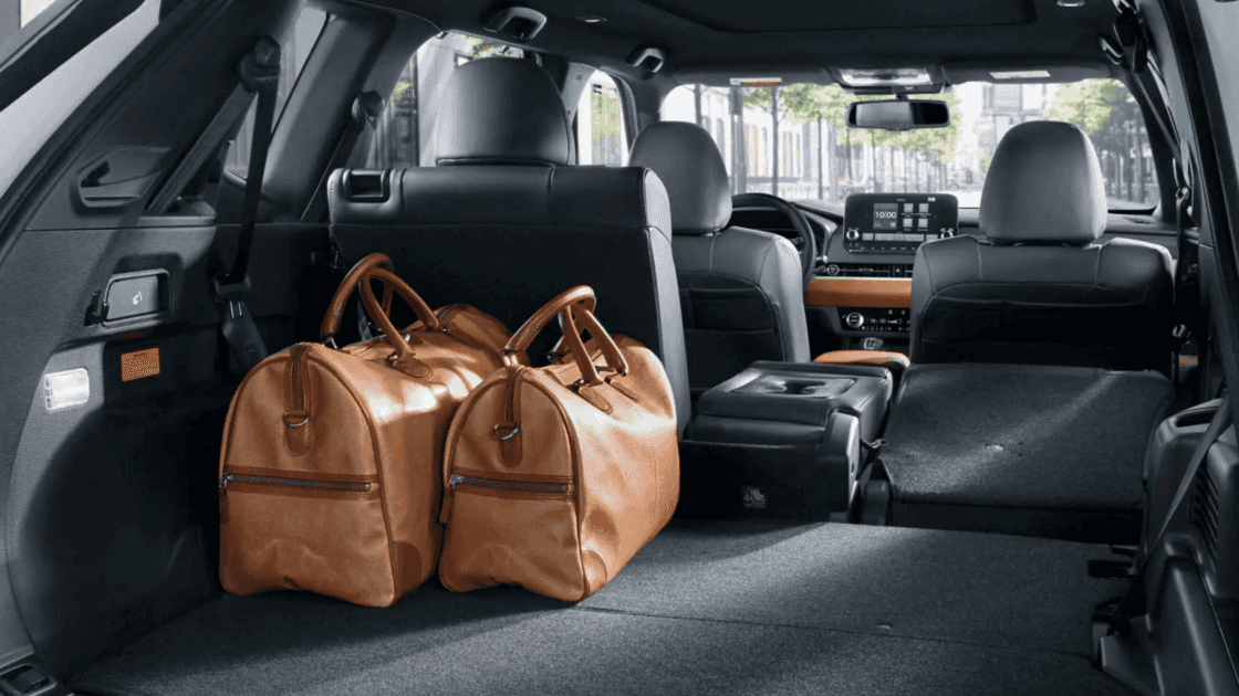 2025 Mitsubishi Outlander PHEV rear cargo area with seats folded showing spacious storage and flexible interior layout