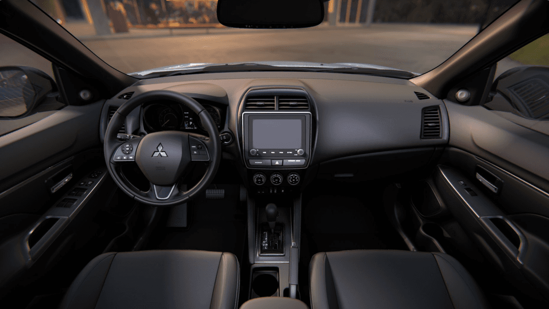 2025 Mitsubishi Outlander Sport interior dashboard with steering wheel and infotainment