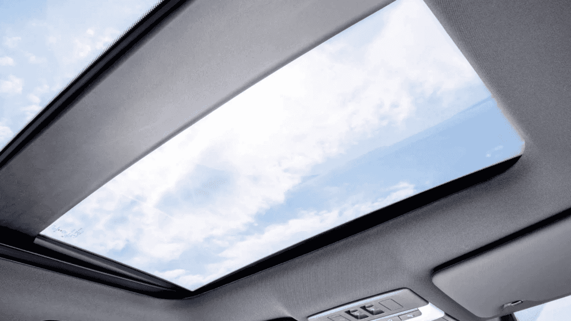 2025 Mitsubishi Outlander PHEV panoramic sunroof interior view showing wide glass roof and overhead control panel