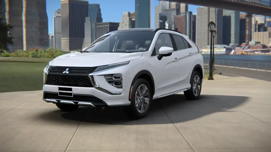 2026 Mitsubishi Eclipse Cross front three quarter exterior in white showing LED lighting, bold grille, and compact SUV profile