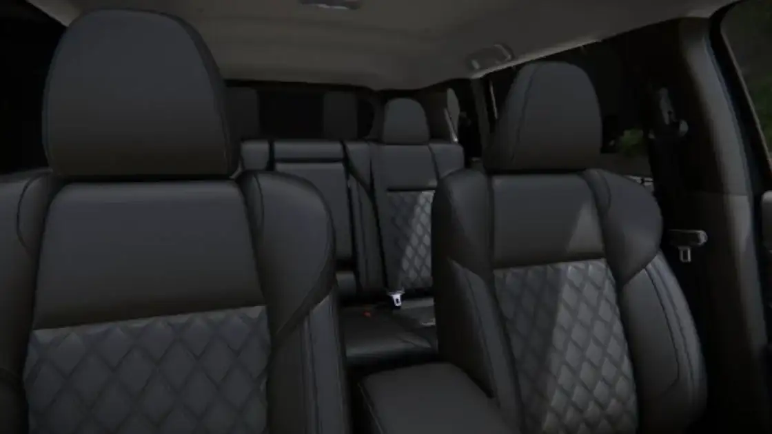 2026 Mitsubishi Outlander interior seating with black leather seats, quilted inserts, and spacious three row cabin design