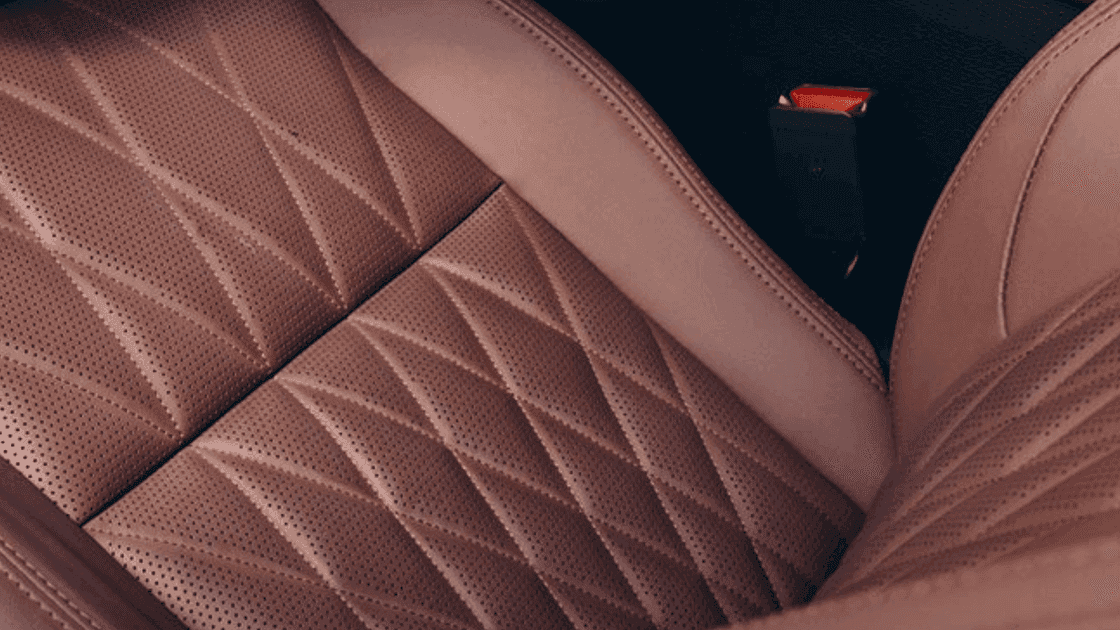 Close up of 2026 Mitsubishi Outlander quilted leather seat upholstery with brown stitching