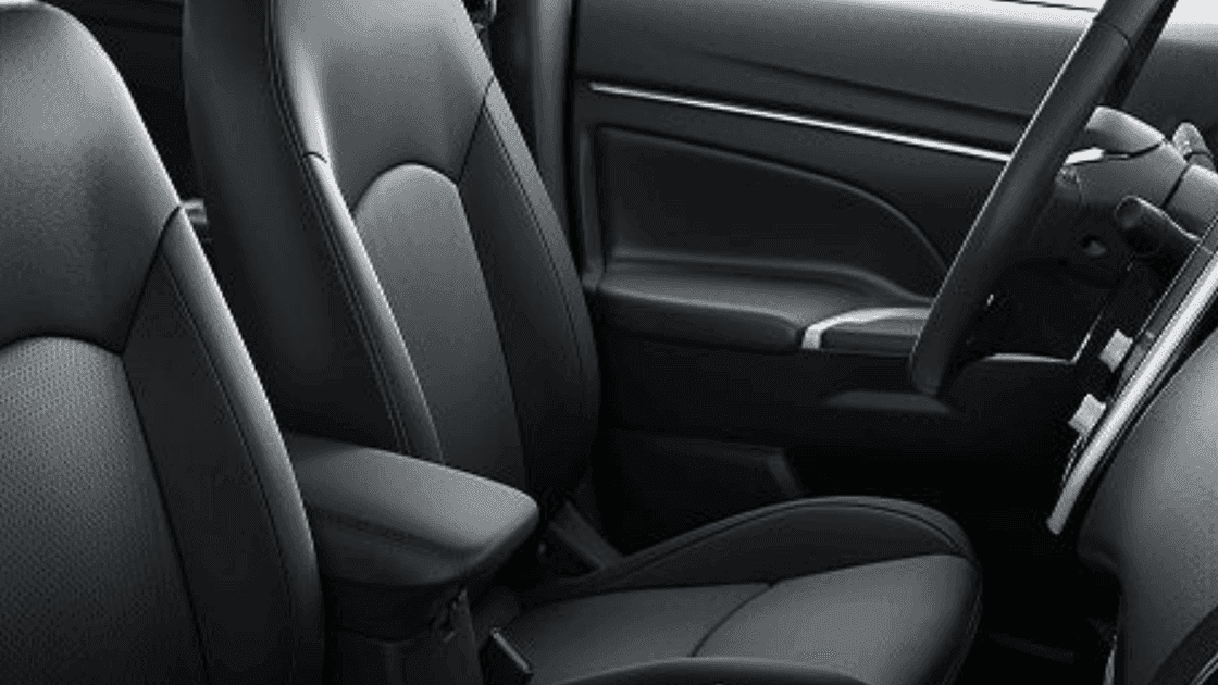 Close up of 2026 Mitsubishi Outlander Sport front cabin with seat base cupholder and door trim