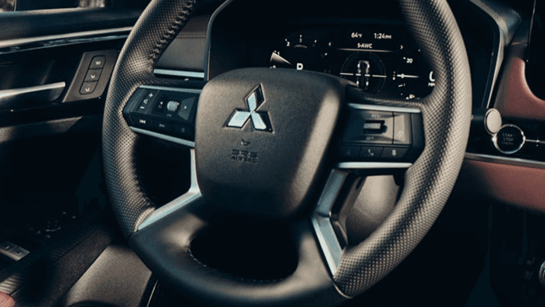 2026 Mitsubishi Outlander steering wheel close-up with digital display and dashboard controls