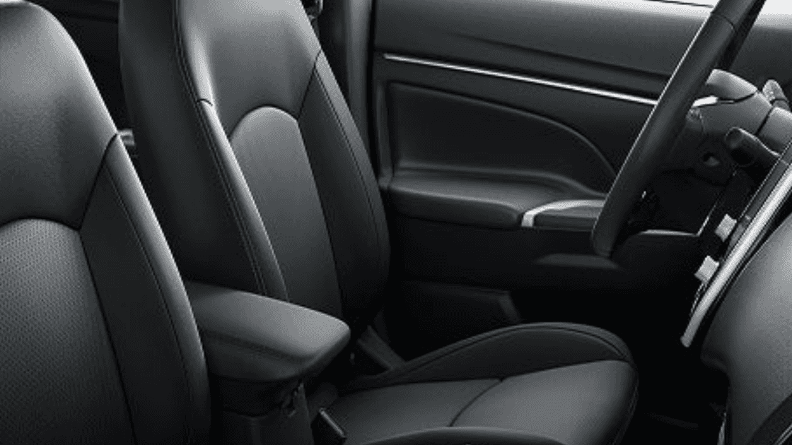2026 Mitsubishi Outlander Sport front seats with black upholstery and center armrest