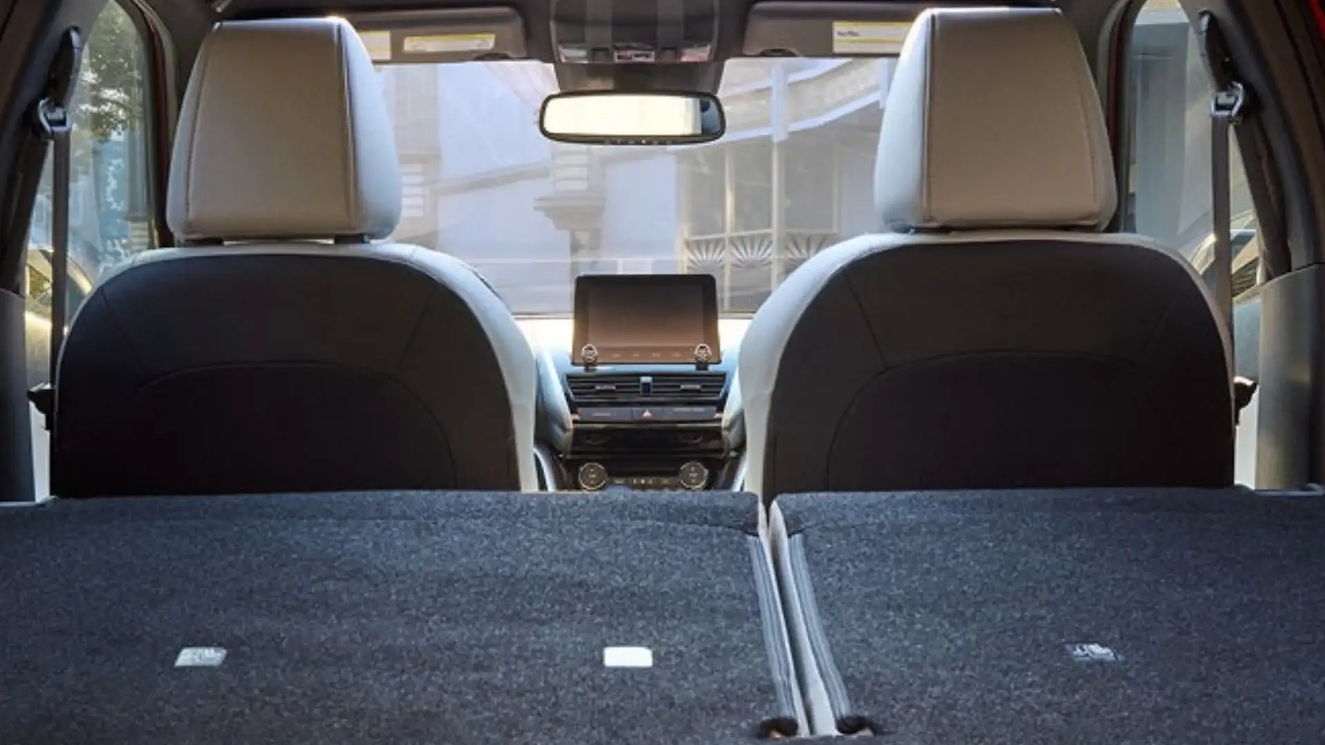 2026 Mitsubishi Eclipse Cross cargo area with rear seats folded flat for added storage space inside.