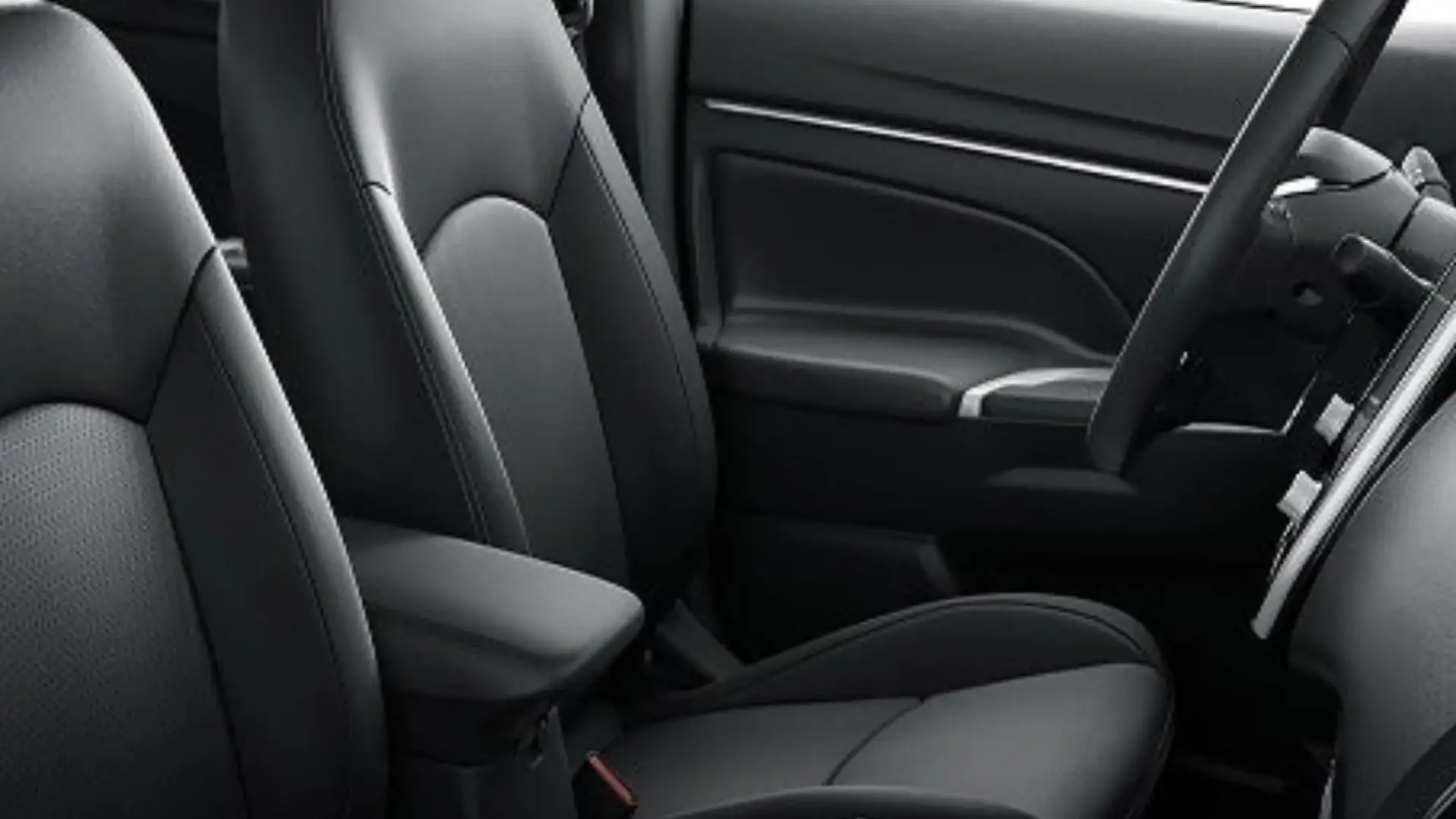 2026 Mitsubishi Outlander Sport interior with black front seats and practical seating layout viewed.