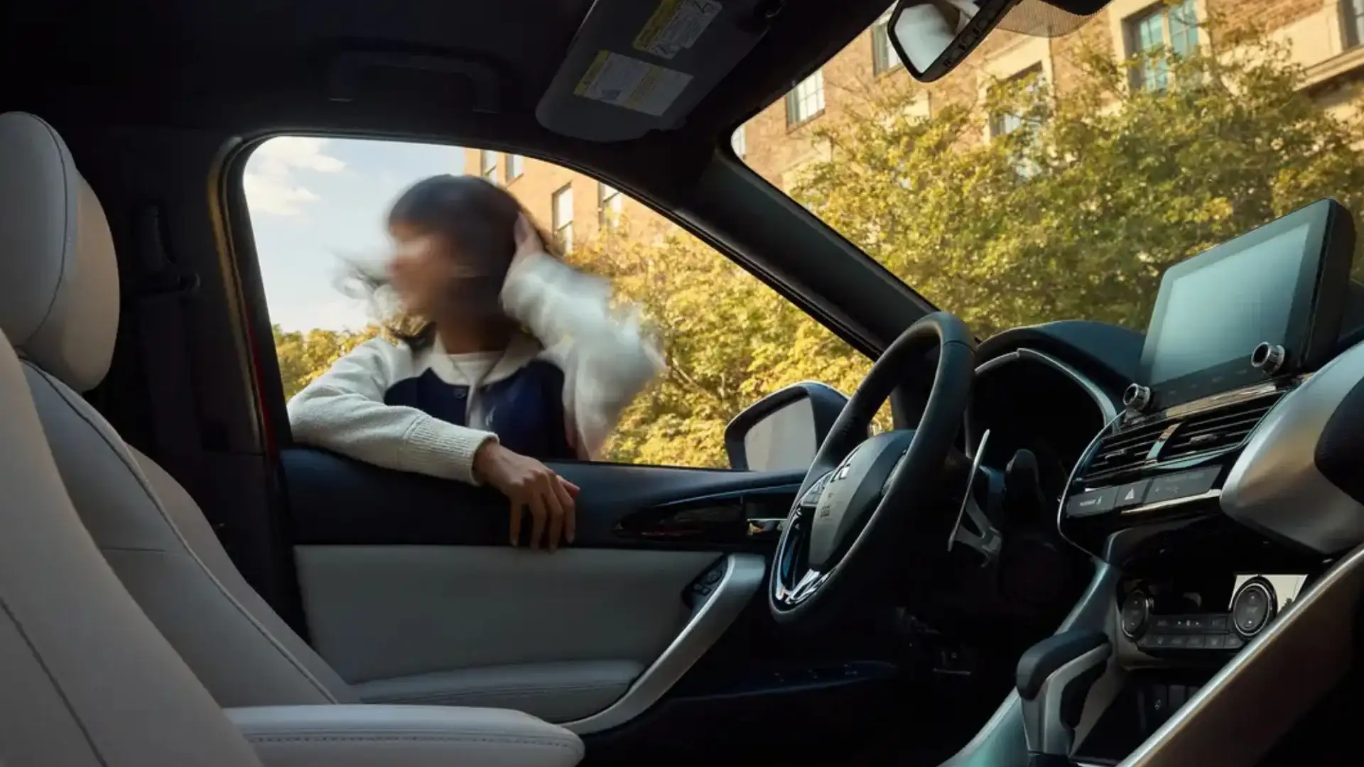 2026 Mitsubishi Eclipse Cross interior with front seats, dashboard, and infotainment screen from cargo area.