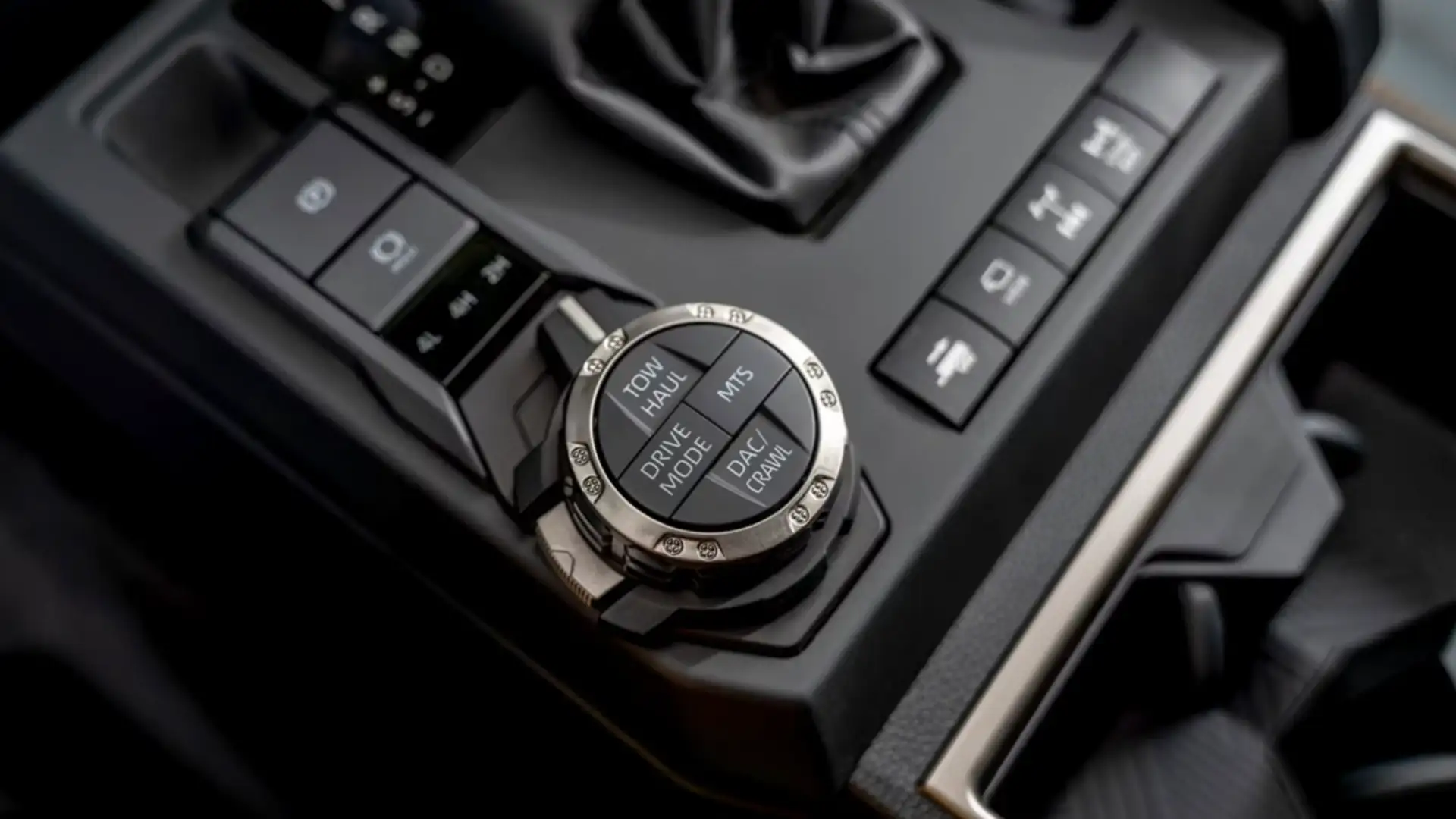 Close-up of the 2025 Toyota 4Runner center console featuring drive mode selector and off-road controls with modern connectivity.