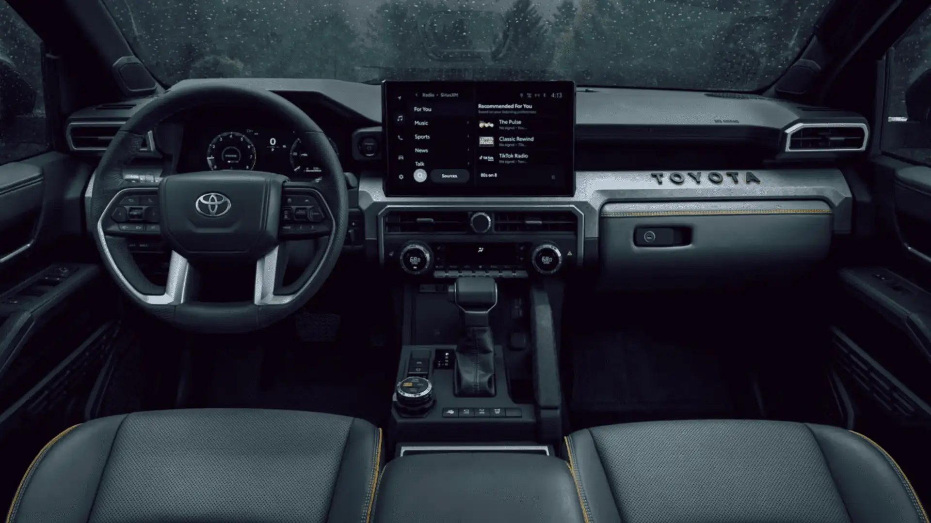 Interior seating view of the 2025 Toyota 4Runner i-FORCE MAX highlighting passenger space, comfort-focused seats, and premium cabin materials.