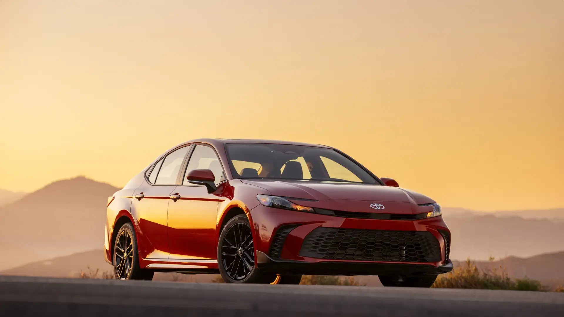 2025 Toyota Camry exterior parked in Greencastle, PA, highlighting sleek sedan design, bold front grille, and modern styling.