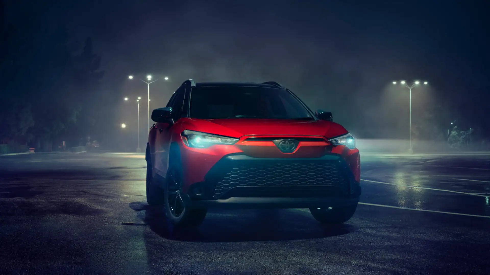 2025 Toyota Corolla Cross Hybrid exterior in Hagerstown, MD photographed at night highlighting modern crossover styling