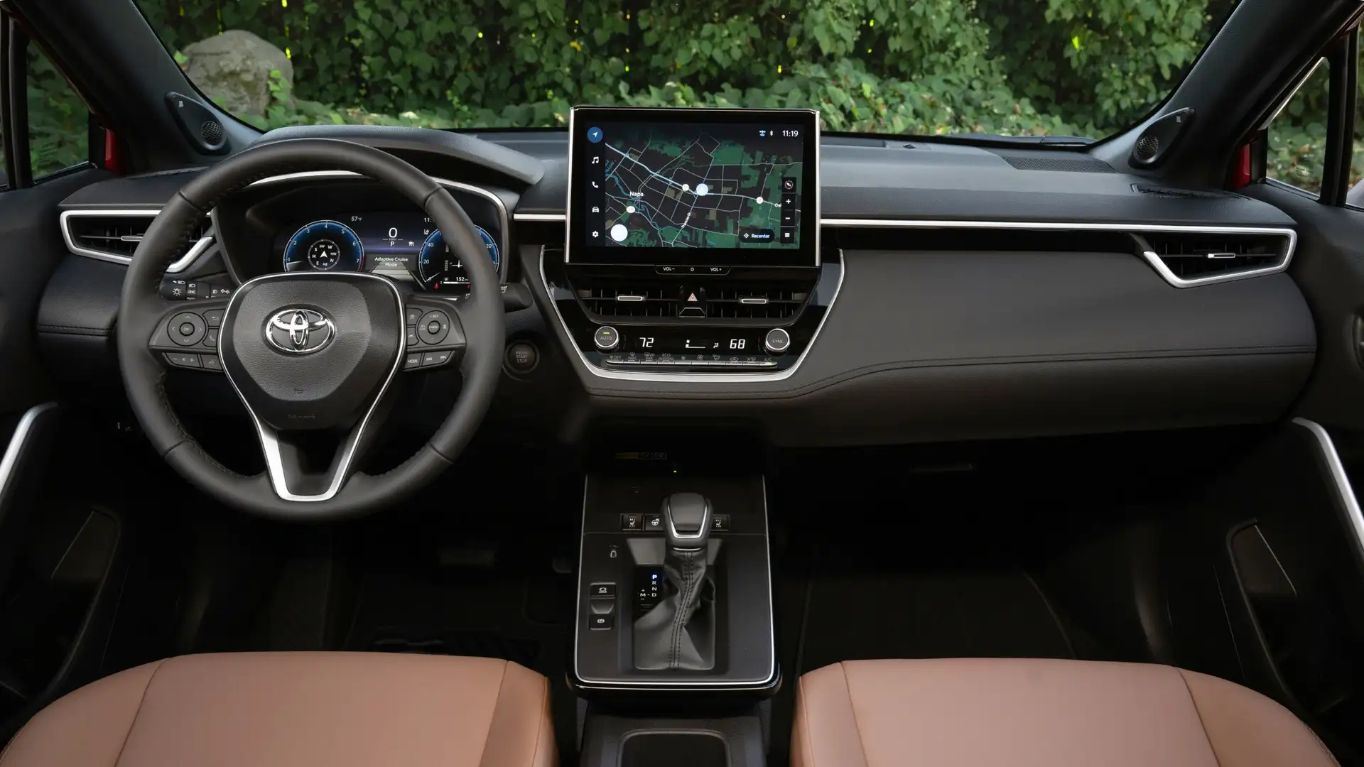 2025 Toyota Corolla Cross interior showcasing touchscreen infotainment system, navigation display, and advanced connectivity features.