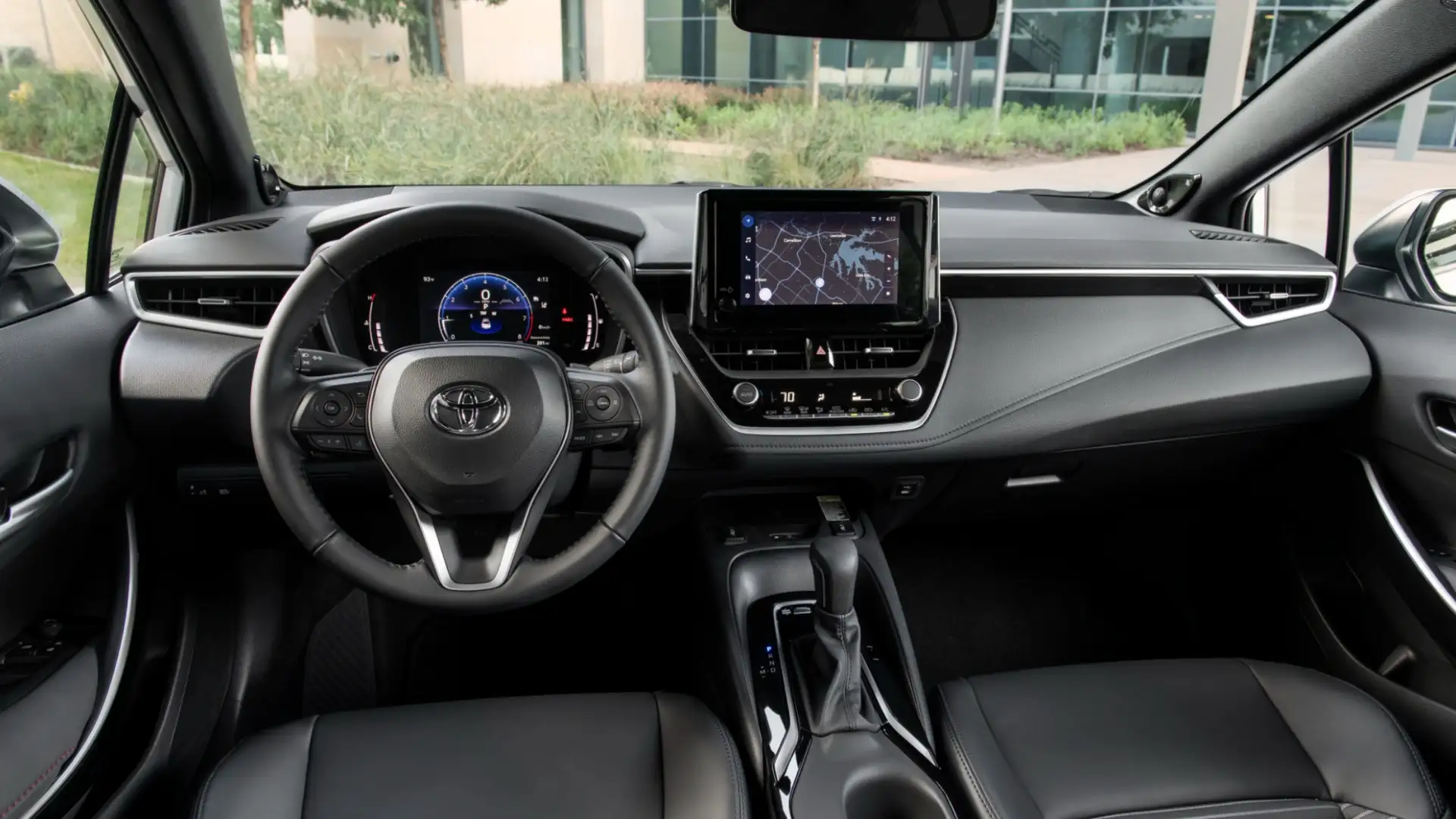 2025 Toyota Corolla dashboard with touchscreen infotainment system, digital display, and integrated connected services for navigation and media.