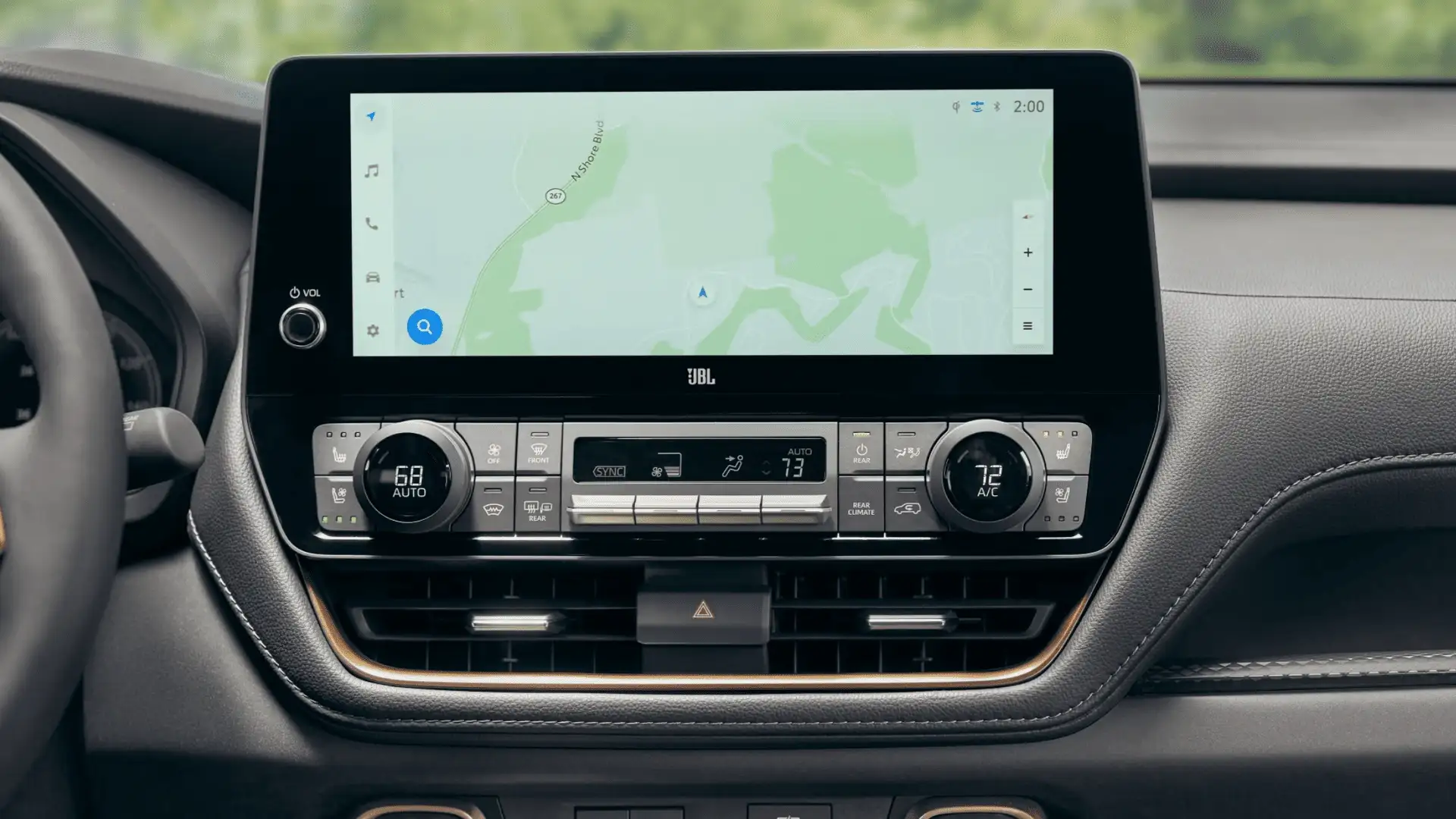 Interior view of the 2025 Toyota Grand Highlander showing the steering wheel, digital display, and integrated driver assistance and safety features.