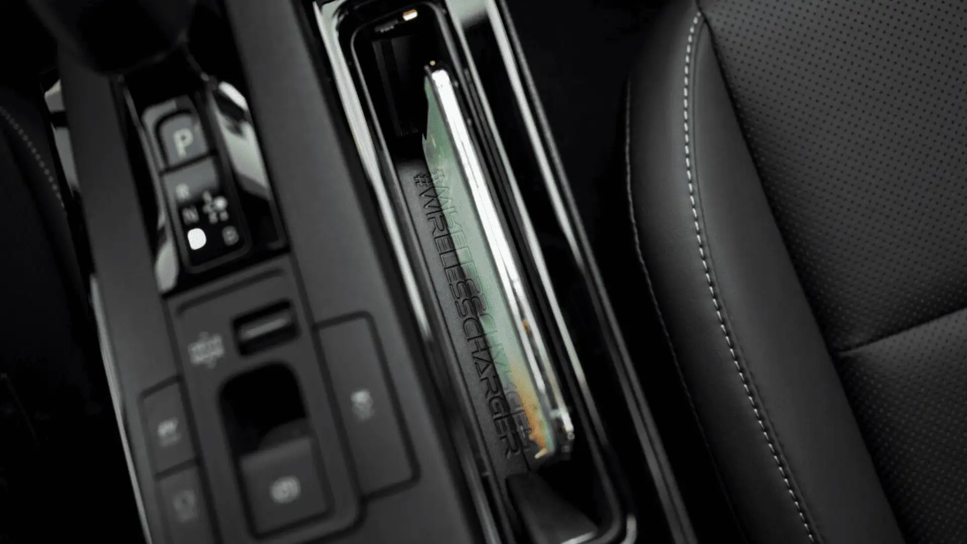 Driver-focused interior of the 2025 Toyota Prius featuring advanced safety displays, digital gauges, and steering wheel controls for enhanced driver assistance.