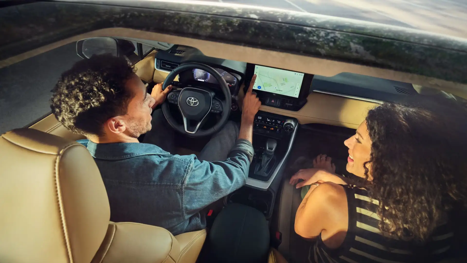 2025 Toyota RAV4 interior showing touchscreen infotainment system, navigation, and connectivity controls for drivers.