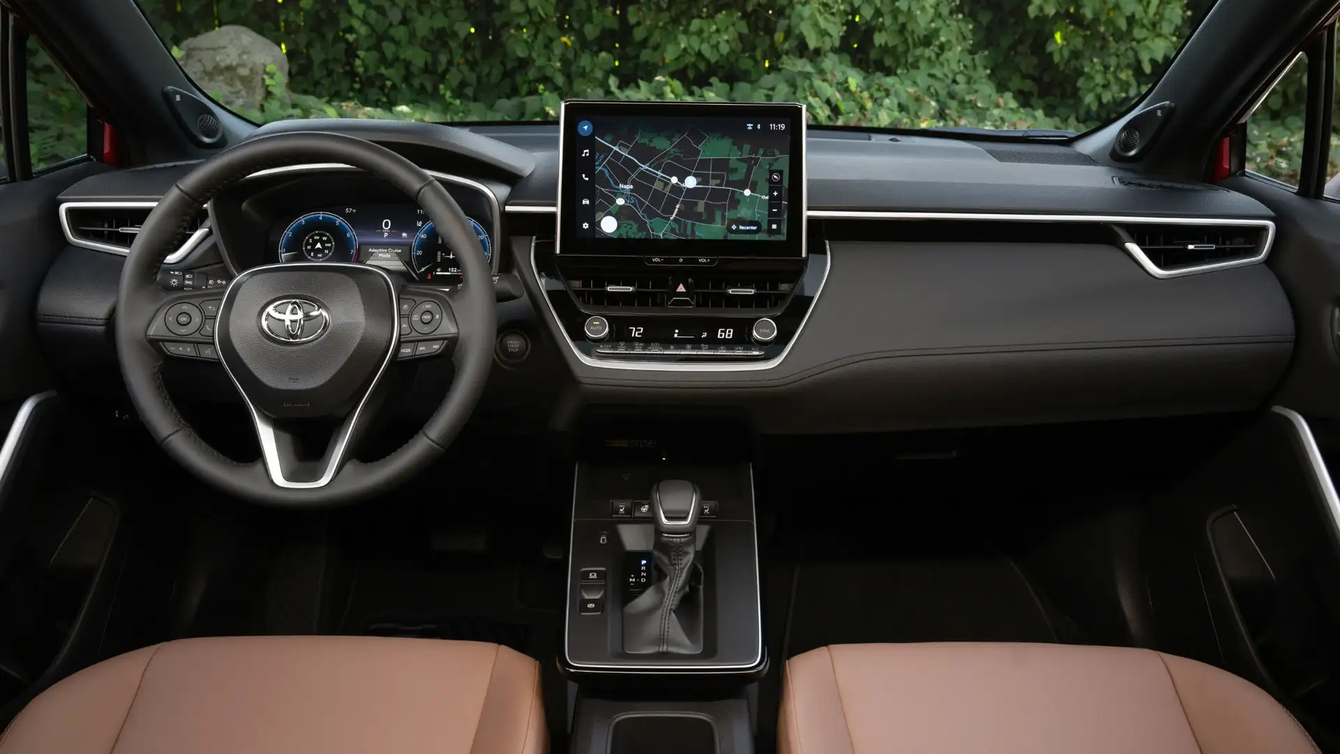 2026 Toyota Corolla Cross interior featuring a wide touchscreen display with navigation, multimedia controls, and digital driver information cluster