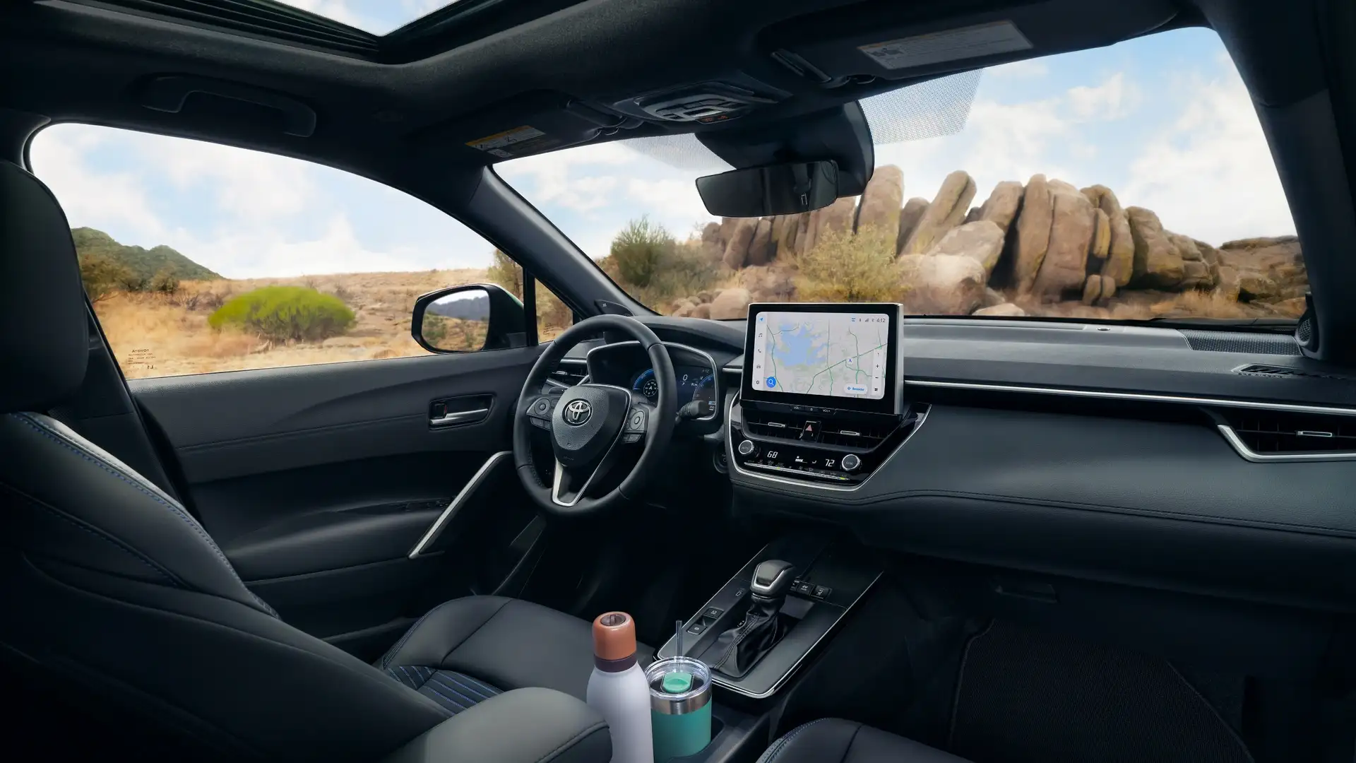2026 Toyota Corolla Cross interior showcasing comfortable seating, panoramic sunroof, and advanced infotainment technology.