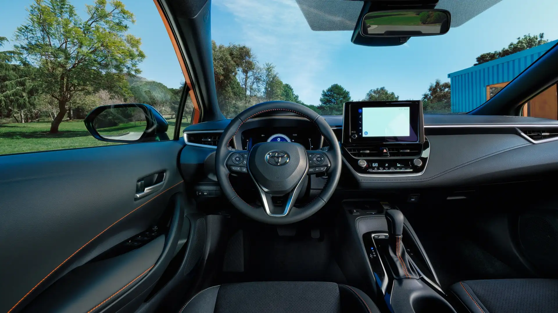 2026 Toyota Corolla Hatchback interior featuring driver-focused cockpit, digital gauge cluster, touchscreen infotainment system, and modern dashboard layout.